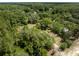 A home enveloped by trees, situated on a large lot for a private, tranquil setting at 29505 North, Paisley, FL 32767