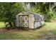 Rustic barn featuring a traditional design with wooden doors, adding character to the property at 29505 North, Paisley, FL 32767