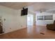 Spacious living room featuring wood-look flooring and a ceiling fan at 29505 North, Paisley, FL 32767