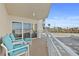Enjoy the fresh air on this balcony with seating, offering a partial view of the surrounding area at 2967 S Atlantic Ave # 202, Daytona Beach Shores, FL 32118