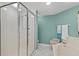 Bright, clean bathroom with a glass-enclosed shower and separate soaking tub at 2967 S Atlantic Ave # 202, Daytona Beach Shores, FL 32118