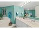 Spacious bathroom boasts a dual sink vanity, with garden tub and decorative architectural trim at 2967 S Atlantic Ave # 202, Daytona Beach Shores, FL 32118