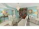 View of dining room with chandelier, bookcase, sitting area, and tile floors at 2967 S Atlantic Ave # 202, Daytona Beach Shores, FL 32118