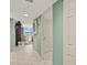 Hallway with light blue walls leads to a living room with ocean views at 2967 S Atlantic Ave # 202, Daytona Beach Shores, FL 32118