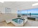 Indoor hot tub with an ocean view, spa rules posted on the wall at 2967 S Atlantic Ave # 202, Daytona Beach Shores, FL 32118