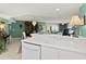 Open kitchen area with breakfast bar overlooking the dining and living areas at 2967 S Atlantic Ave # 202, Daytona Beach Shores, FL 32118