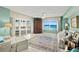 View of living area with floor-to-ceiling windows and access to the balcony at 2967 S Atlantic Ave # 202, Daytona Beach Shores, FL 32118