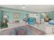 Open living space showcasing an area rug and furniture, flowing into the kitchen and dining area at 2967 S Atlantic Ave # 202, Daytona Beach Shores, FL 32118