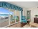 Relaxing room that leads to a balcony with ocean views at 2967 S Atlantic Ave # 202, Daytona Beach Shores, FL 32118