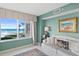 Living area featuring ocean views, tile flooring, and comfortable seating at 2967 S Atlantic Ave # 202, Daytona Beach Shores, FL 32118