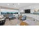 Living room area with stylish furniture, TV, kitchenette and ocean view at 2967 S Atlantic Ave # 202, Daytona Beach Shores, FL 32118