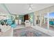 Open living space with a sliding door to the balcony, flowing into the kitchen and dining area at 2967 S Atlantic Ave # 202, Daytona Beach Shores, FL 32118