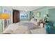 Comfortable living area with ocean views, featuring armchairs, lamps, and an area rug at 2967 S Atlantic Ave # 202, Daytona Beach Shores, FL 32118