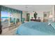 Spacious main bedroom with balcony access and ocean views, creating a relaxing retreat at 2967 S Atlantic Ave # 202, Daytona Beach Shores, FL 32118