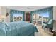 Serene main bedroom with ocean views, balcony access, and comfortable seating area at 2967 S Atlantic Ave # 202, Daytona Beach Shores, FL 32118
