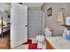 Cozy bathroom with a shower featuring patterned curtains, a toilet, and vanity at 3001 Inca Ct, Deltona, FL 32738