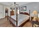 Spacious bedroom featuring a classic four-poster bed, wood floors, and ample natural light at 3001 Inca Ct, Deltona, FL 32738