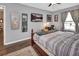 A serene bedroom with neutral gray walls and hardwood floors at 3001 Inca Ct, Deltona, FL 32738