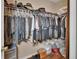 Walk-in closet featuring an organized collection of clothes, hats, and bags at 3001 Inca Ct, Deltona, FL 32738