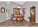 Inviting dining room with wood floors, cabinets, and a view of the kitchen at 3001 Inca Ct, Deltona, FL 32738
