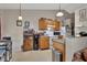 Efficient kitchen with essential appliances and cabinetry, open to the living area at 3001 Inca Ct, Deltona, FL 32738