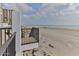 Balcony view overlooking the sandy beach and ocean, great for relaxation and enjoying sunrises at 3003 S Atlantic Ave # 21A2, Daytona Beach Shores, FL 32118
