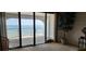 Balcony doors overlook breathtaking ocean views, creating a serene and inviting ambiance at 3003 S Atlantic Ave # 21A2, Daytona Beach Shores, FL 32118