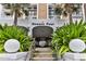 Welcoming Oceans Four entrance featuring lush landscaping and classic architectural details at 3003 S Atlantic Ave # 21A2, Daytona Beach Shores, FL 32118
