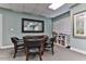 Community game room with game table, comfortable seating and shelving at 3003 S Atlantic Ave # 21A2, Daytona Beach Shores, FL 32118