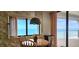 Eat-in kitchen with ocean view and balcony access at 3003 S Atlantic Ave # 21A2, Daytona Beach Shores, FL 32118