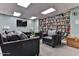Cozy library with a large bookshelf, comfortable seating, and a television at 3003 S Atlantic Ave # 21A2, Daytona Beach Shores, FL 32118