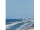 Breathtaking ocean view showcasing the beach, pier, and city skyline in the distance at 3003 S Atlantic Ave # 21A2, Daytona Beach Shores, FL 32118