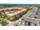 Wide aerial view of community featuring colorful apartments, lush landscaping, and convenient parking at 3049 Meleto Blvd, New Smyrna Beach, FL 32168