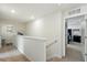 Upstairs hallway with access to the laundry room and the bedroom at 3049 Meleto Blvd, New Smyrna Beach, FL 32168