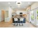 Bright kitchen features a granite countertop island with bar seating, modern stainless steel appliances, and access to the outside at 3049 Meleto Blvd, New Smyrna Beach, FL 32168