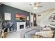 Cozy living room with fireplace, large TV, comfortable seating, and stylish decor at 3049 Meleto Blvd, New Smyrna Beach, FL 32168