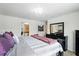 Comfortable main bedroom features stylish decor and a chandelier at 3049 Meleto Blvd, New Smyrna Beach, FL 32168
