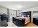 Comfortable main bedroom features stylish decor, a large window, and a chandelier at 3049 Meleto Blvd, New Smyrna Beach, FL 32168