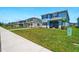 Street view of well-maintained homes with green lawns in a residential neighborhood at 3049 Meleto Blvd, New Smyrna Beach, FL 32168