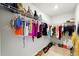 Organized walk-in closet with wire shelving and rods, plus organized shoes on the floor at 3049 Meleto Blvd, New Smyrna Beach, FL 32168