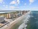 Breathtaking aerial view of the beachfront condos along the coast, offering stunning ocean views at 3145 S Atlantic Ave # 503, Daytona Beach Shores, FL 32118