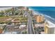 Scenic aerial view of coastal condos along a beachfront road, offering easy access to the beach at 3145 S Atlantic Ave # 503, Daytona Beach Shores, FL 32118