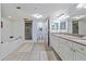 Well-lit bathroom with tub and separate shower at 3145 S Atlantic Ave # 503, Daytona Beach Shores, FL 32118