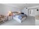 Carpeted bedroom with ceiling fan and ensuite access at 3145 S Atlantic Ave # 503, Daytona Beach Shores, FL 32118