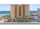 Oceanfront condo building with a parking lot lined with palm trees and direct beach access at 3145 S Atlantic Ave # 503, Daytona Beach Shores, FL 32118