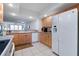 Kitchen with granite countertops, white cabinets, and tile floors, featuring stainless steel appliances at 3145 S Atlantic Ave # 503, Daytona Beach Shores, FL 32118