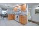 Bright kitchen featuring tile floors, wood cabinets, and a full appliance package at 3145 S Atlantic Ave # 503, Daytona Beach Shores, FL 32118