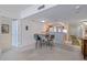 Open-concept living space with dining area and kitchen featuring hardwood floors at 3145 S Atlantic Ave # 503, Daytona Beach Shores, FL 32118