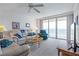 Cozy living room with ocean views, comfortable seating, and lots of natural light at 3145 S Atlantic Ave # 503, Daytona Beach Shores, FL 32118