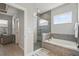 Modern bathroom featuring a luxurious shower with glass surround and a soaking tub at 3229 Medici Blvd, New Smyrna Beach, FL 32168